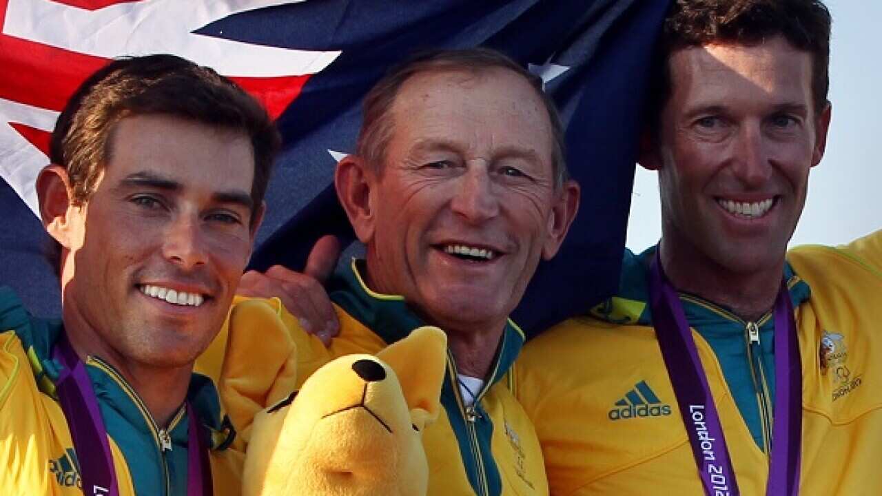 Australia's 470 Olympic Gold medal winners Mathew Belcher and Malcolm Page with their coach Victor Kovalenko after this evening's medal ceremony in Weymouth..