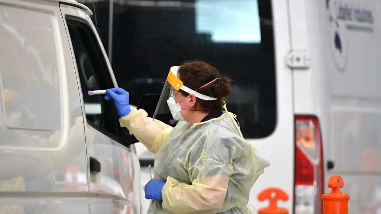 Members of the public are tested at a COVID-19 testing centre in Melbourne. 