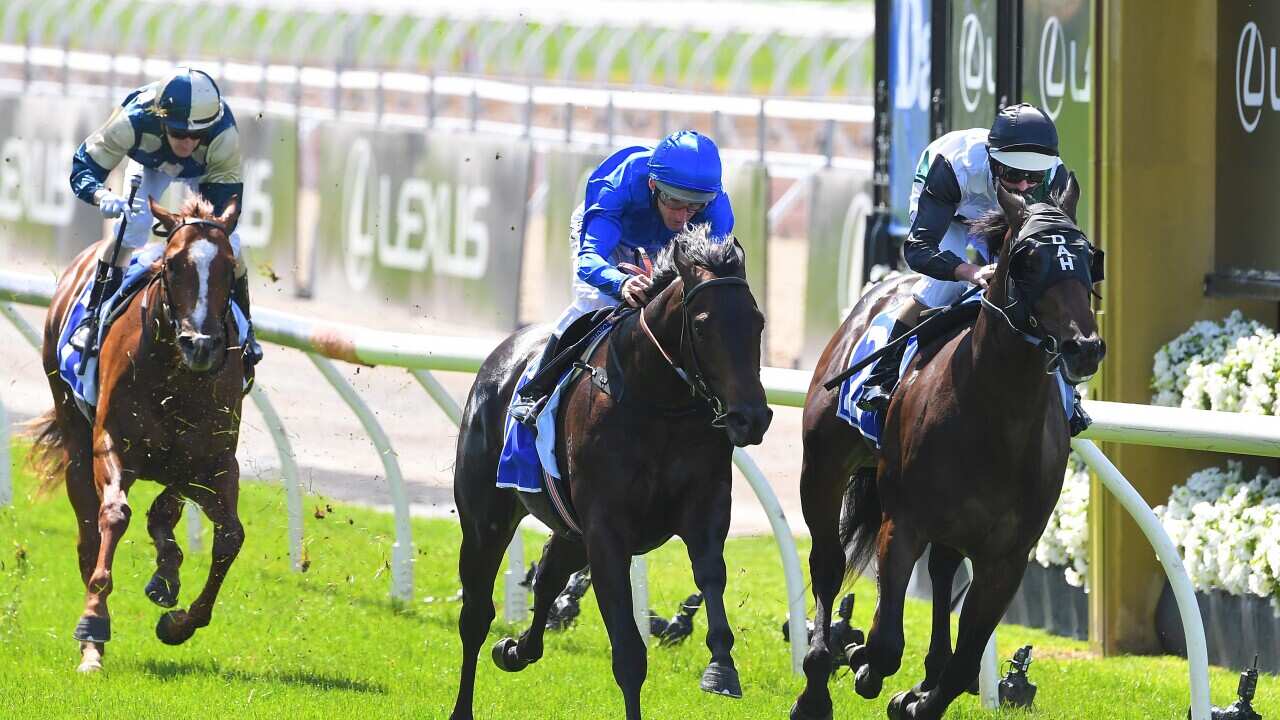 Jockey Luke Nolen (right) rides Finance Tycoon to victory in race 1, the Darley Maribyrnong Plate during Melbourne Cup day.