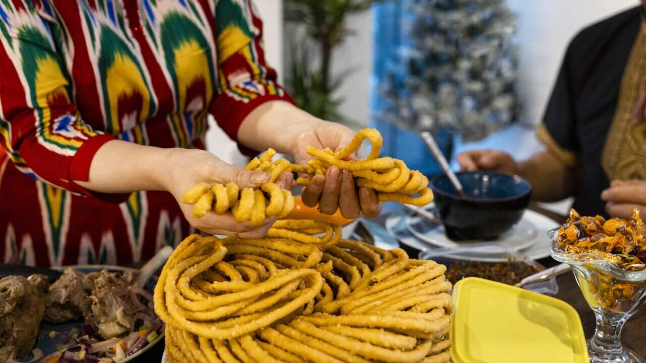 A Uyghur celebration of Eid al-Fitr usually features sangza: deep-fried noodles in a twisted pyramid shape.