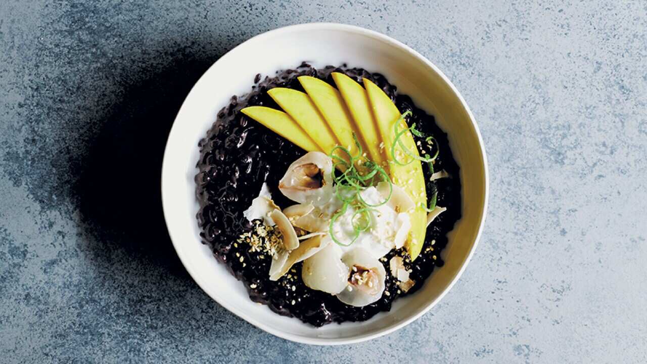 Black rice breakfast with tropical fruit