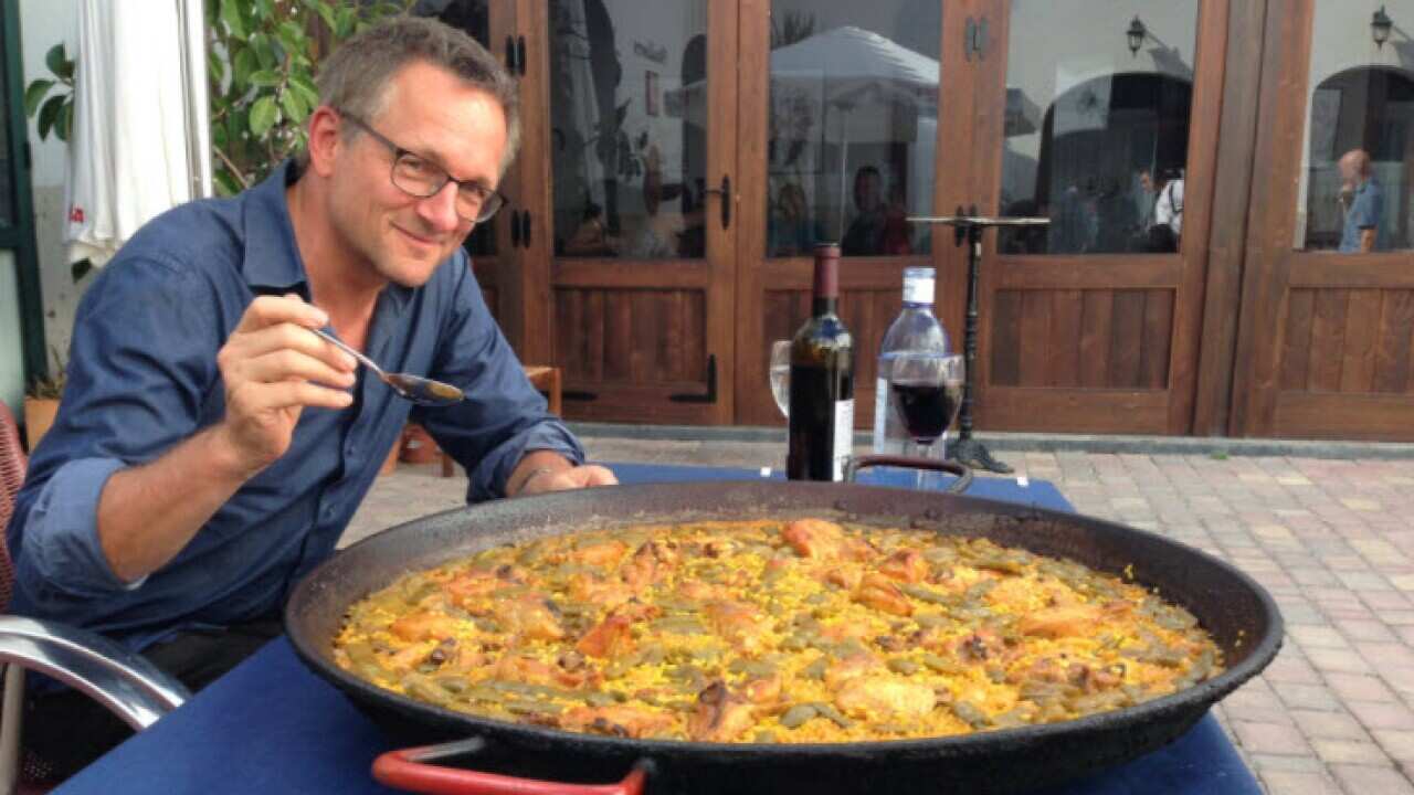 Michael Mosley eating a paella