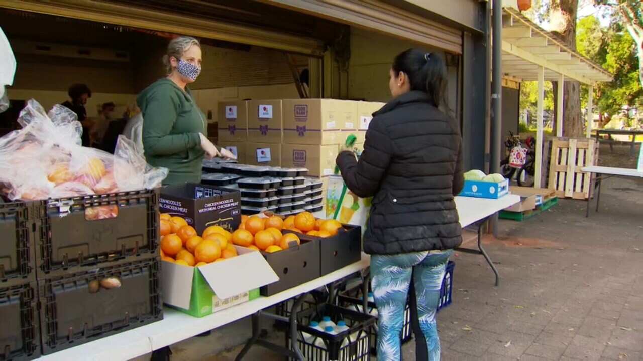 Lining up at a food bank for students