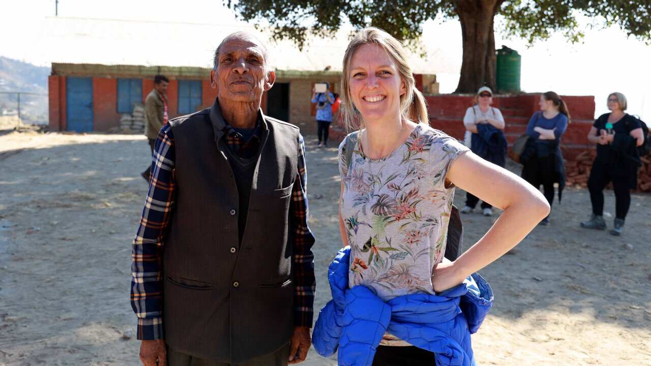 Stephanie Woollard OAM speaking to SBS Nepali