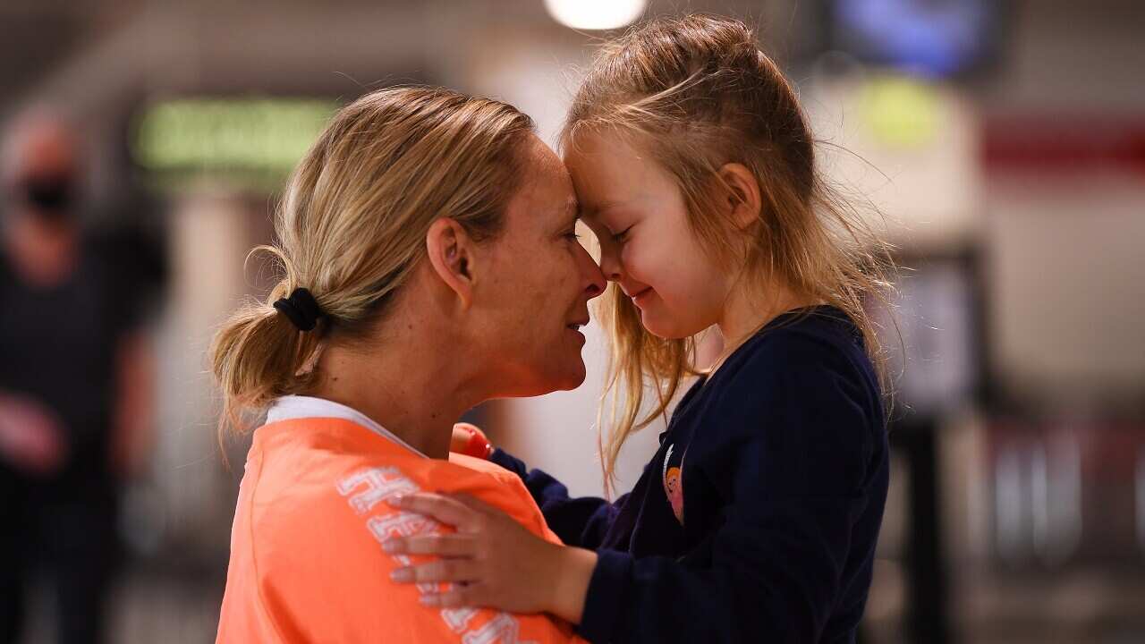 Melanie Brisbane-Schilling (left) and daughter Maddie are reunited after spending two months apart after Melanie to Melbourne from Sydney.