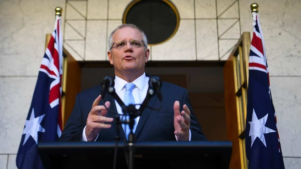 Image of Scott Morrison announcing the 18 May election date at a press conference.