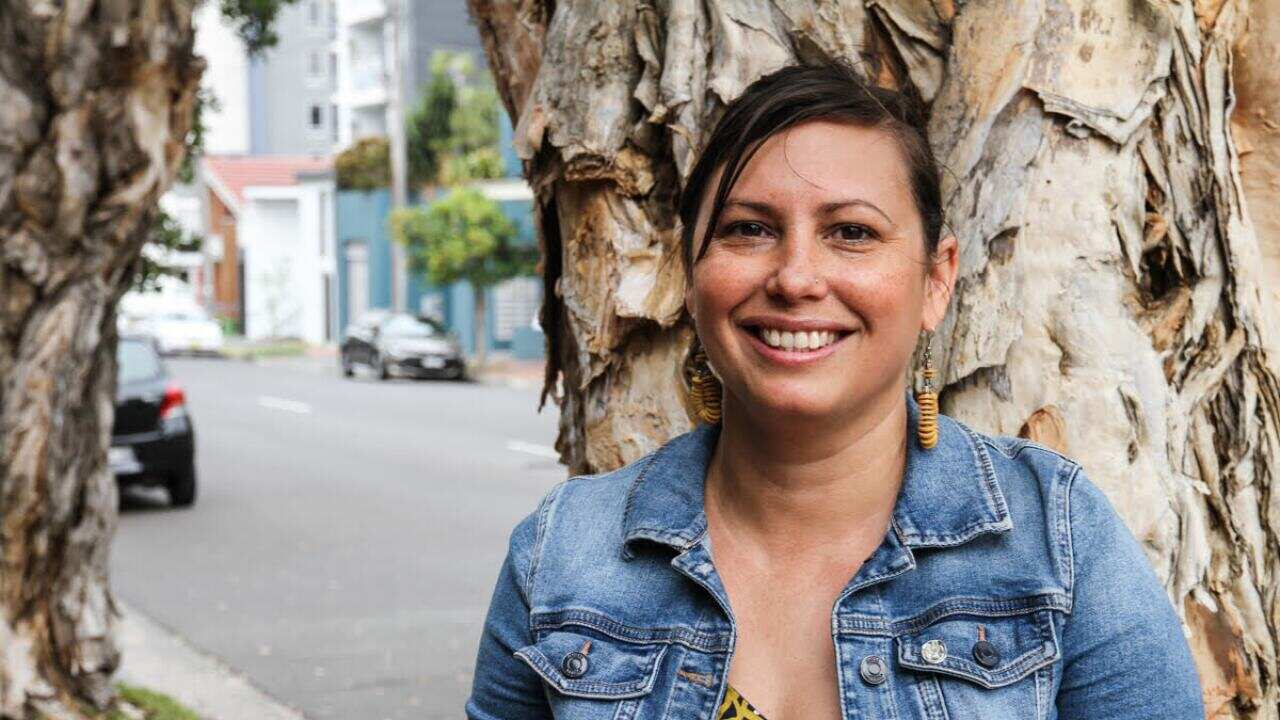 woman standing in front of tree