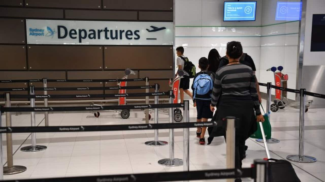 Passengers departing an airport