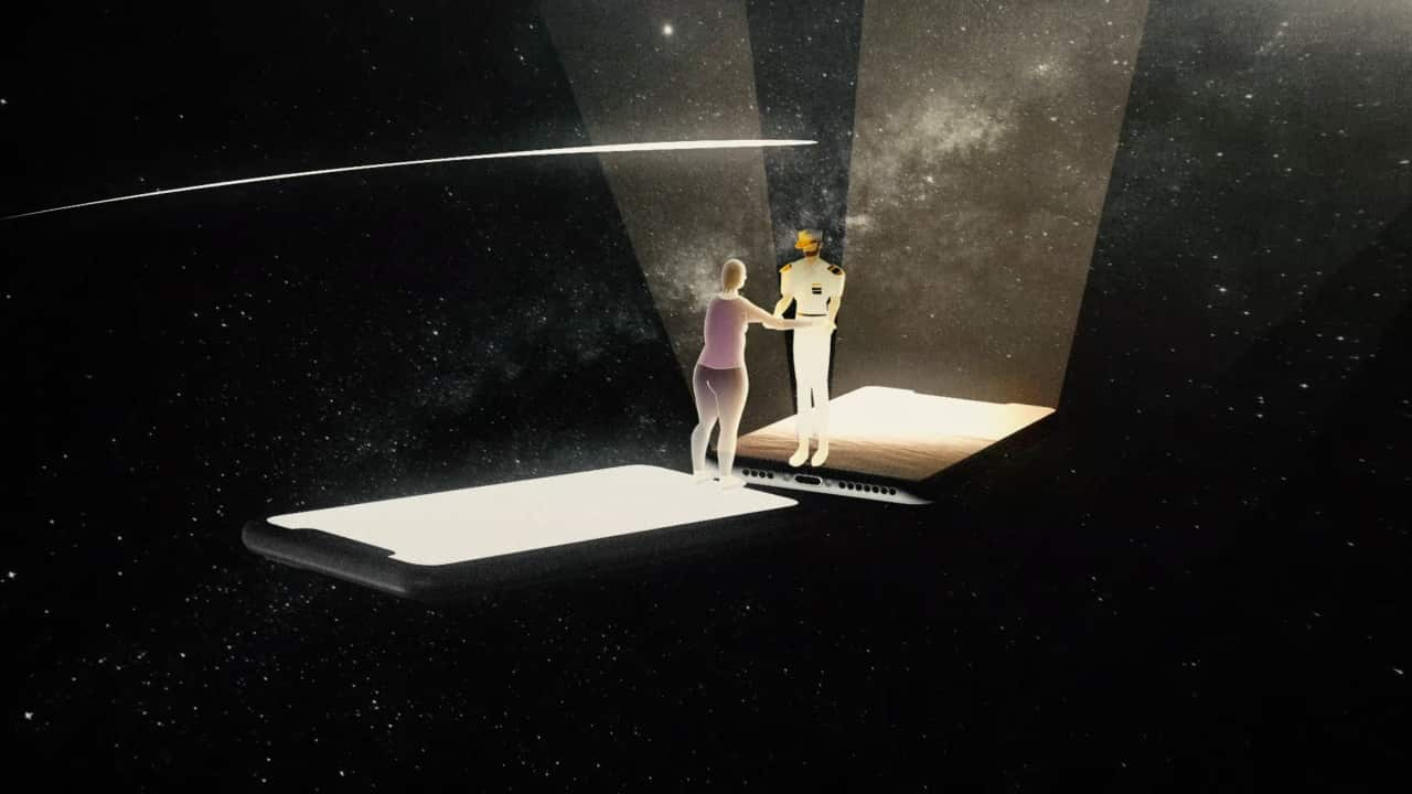 An animated image of a captain and a lady holding hands on individually lit smartphones against the backdrop of a galaxy