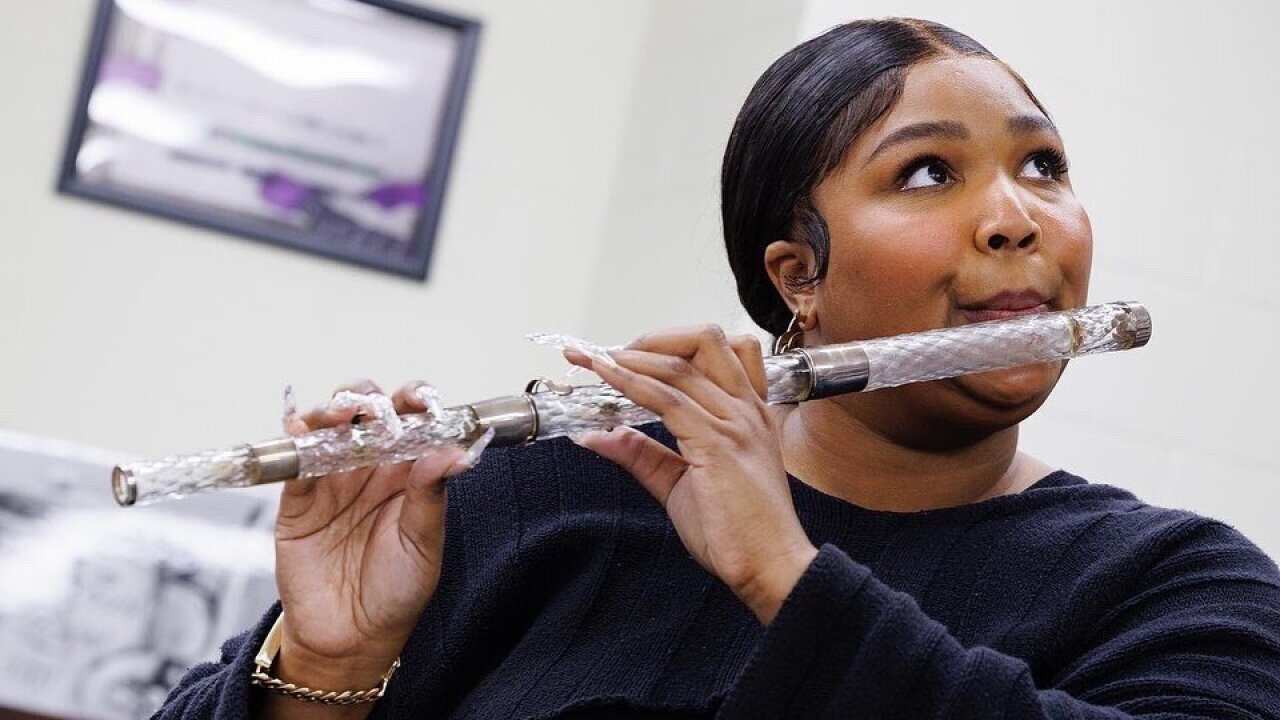 Woman plays a crystal flute 