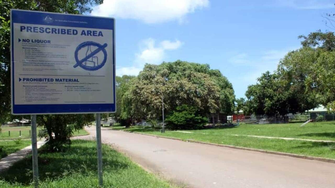 A blue sign declaring the proibition of alcohol in front of a nothern territory community