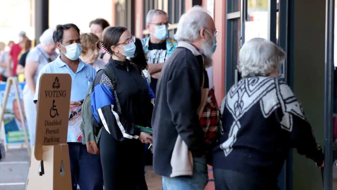 Voters queue outside an Australian Electoral Commission early voting centre in Willetton in the Federal electorate of Tangney in Perth, Tuesday, 17 May, 2022