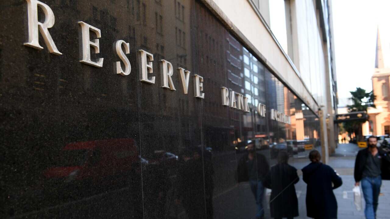 People walk past the Reserve Bank of Australia in Sydney.