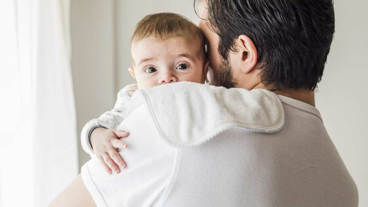 Father burping his baby