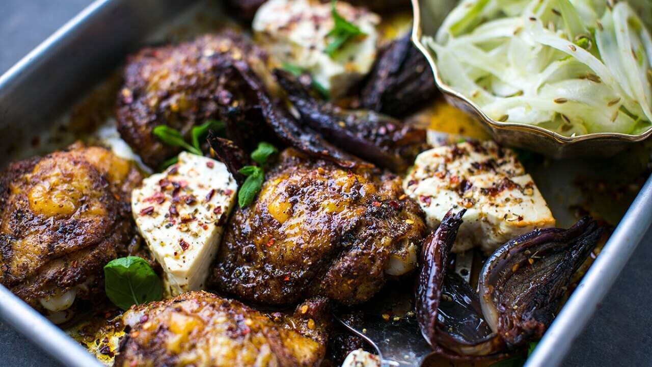 Ras el hanout chicken thighs with baked feta and shaved fennel