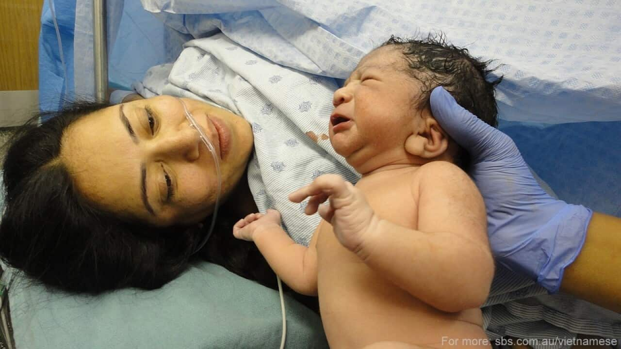 women giving birth, new born child