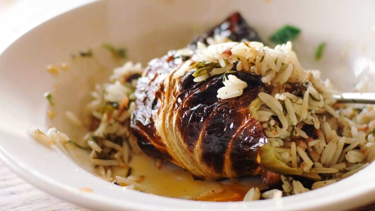 Whole cabbage stuffed with rice