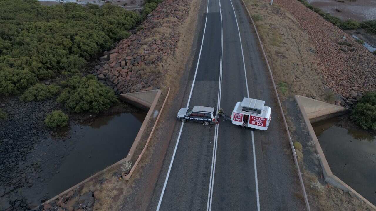 Protestors block the main road to the Burrup Peninsula industrial hub