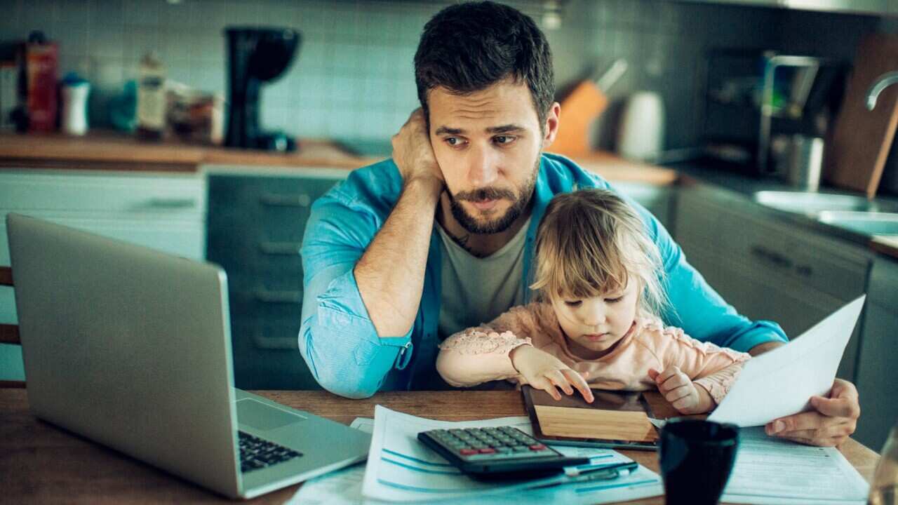 Close up of a father and daughter in their kitchen