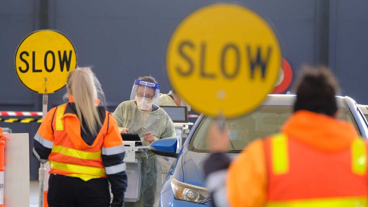 Health workers conduct COVID-19 testing at the Melbourne Showgrounds site in Ascot Vale, Monday 7 June, 2021.