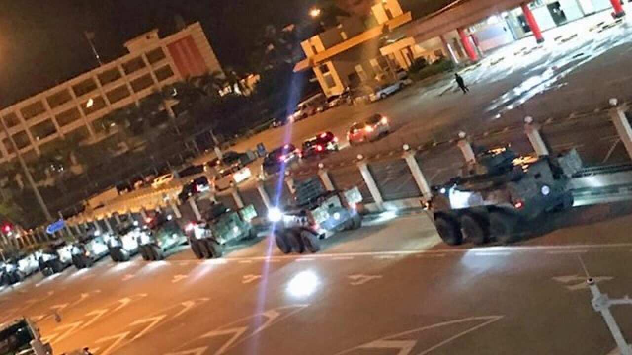 Chinese state media shows tanks and armed personnel carriers rolling through Hong Kong