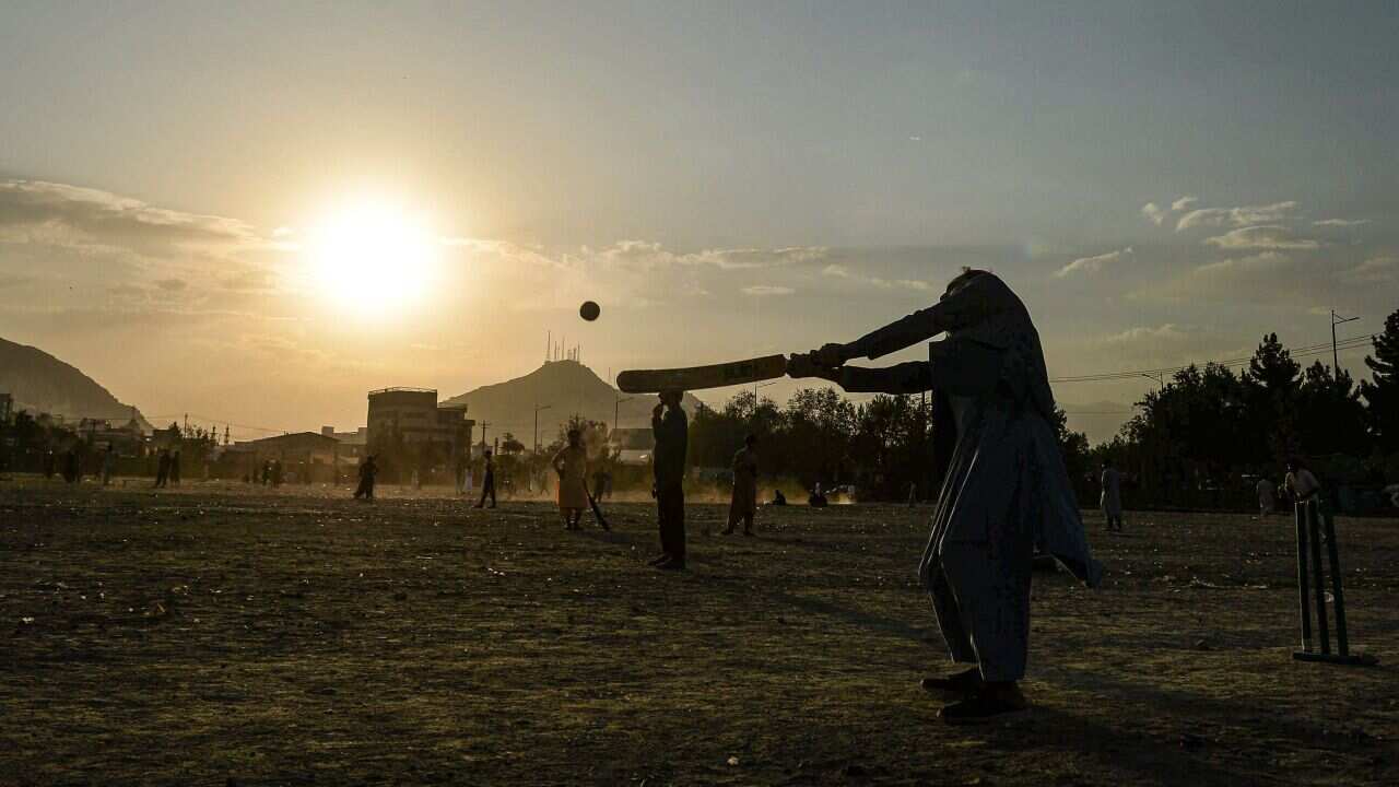 People play cricket at Chaman-e-Huzuri park in Kabul on September 24, 2021. (Photo by Hoshang Hashimi / AFP) (Photo by HOSHANG HASHIMI/AFP via Getty Images)