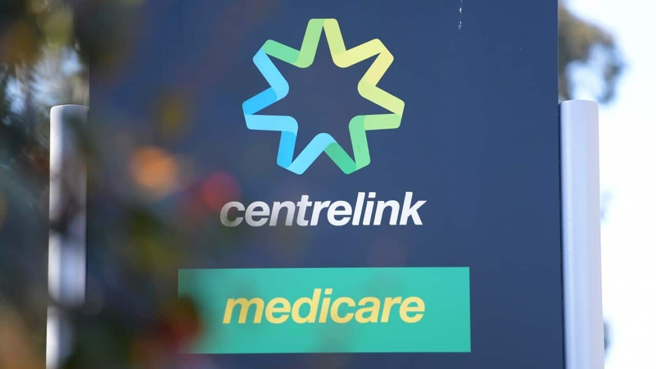 A large sign with the Centrelink and Medicare logos. 