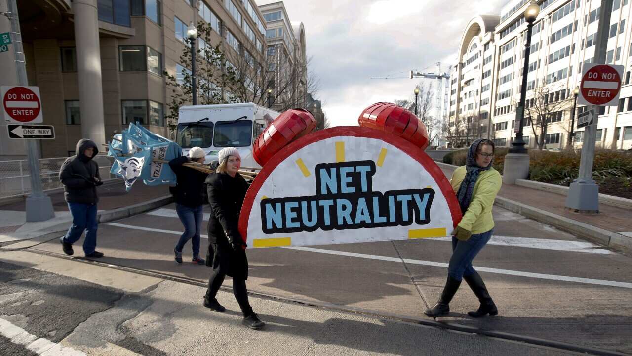 Americans protesting the FCC's decision to scrap net neautrality laws in Washington. 