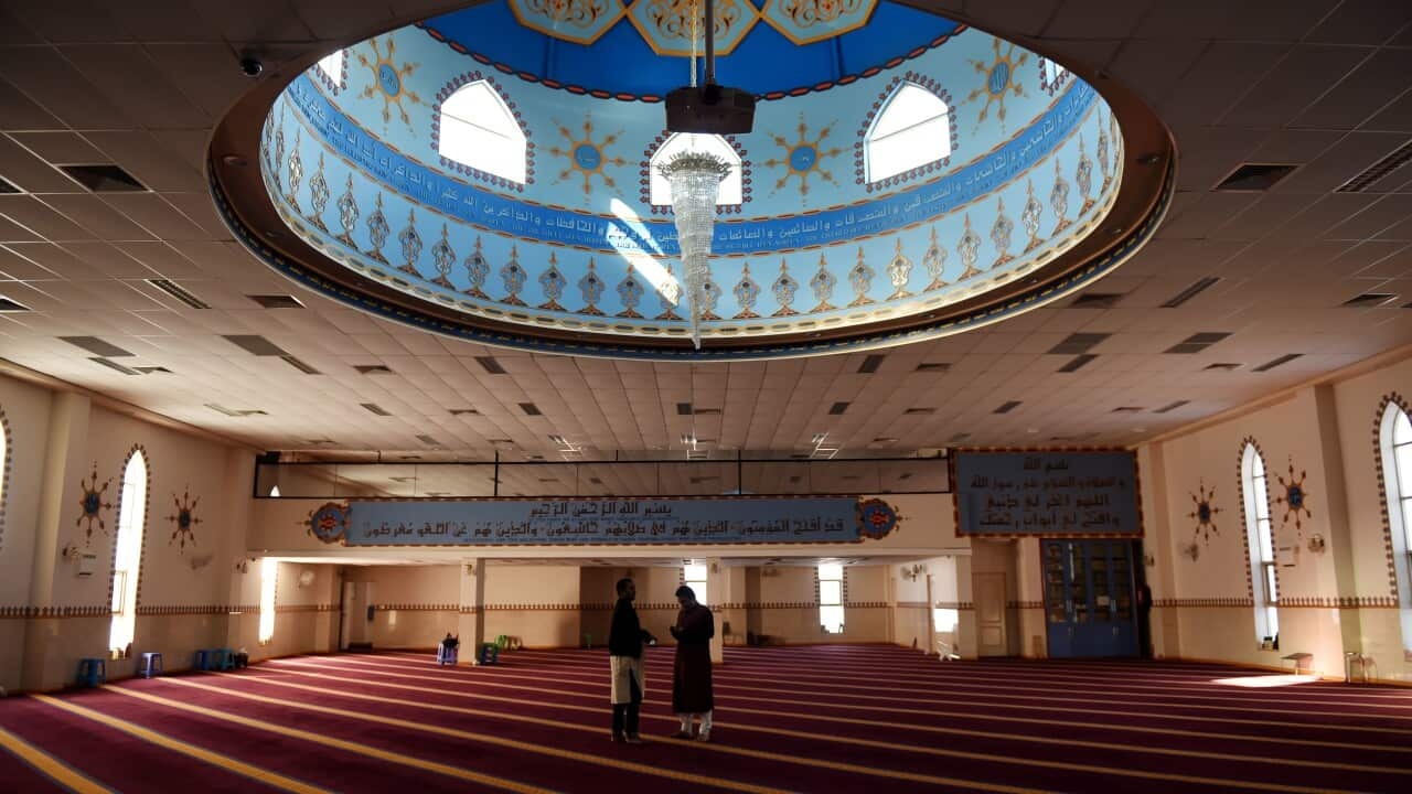 Men gather to pray at Lakemba Mosque in Sydney, Friday, Aug. 22, 2014. (AAP Image/Tracey Nearmy) NO ARCHIVING, EDITORIAL USE ONLY