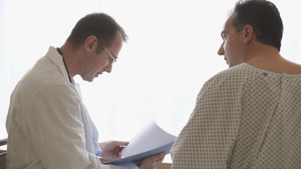 Hospital Doctor With Patient