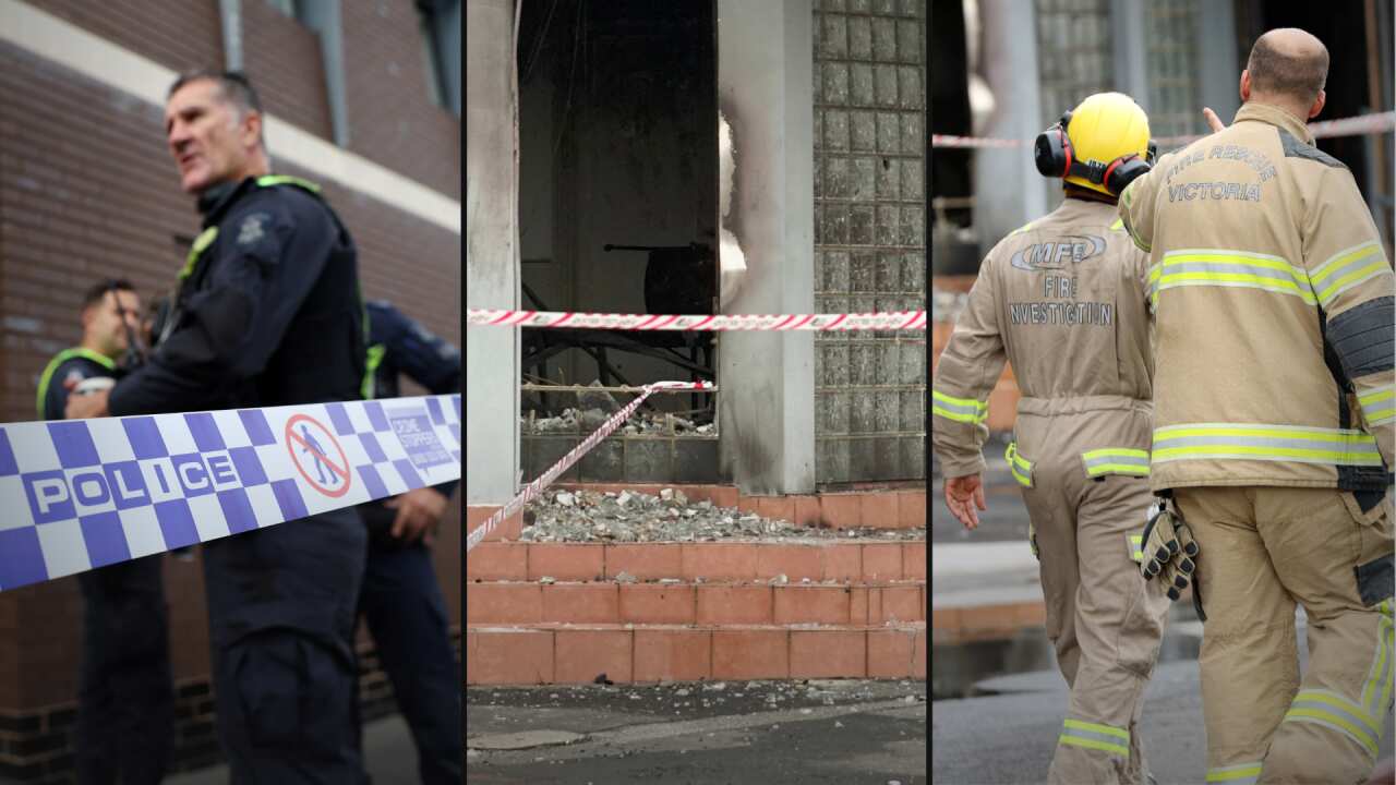 Fire inspectors inspecting a damaged building.