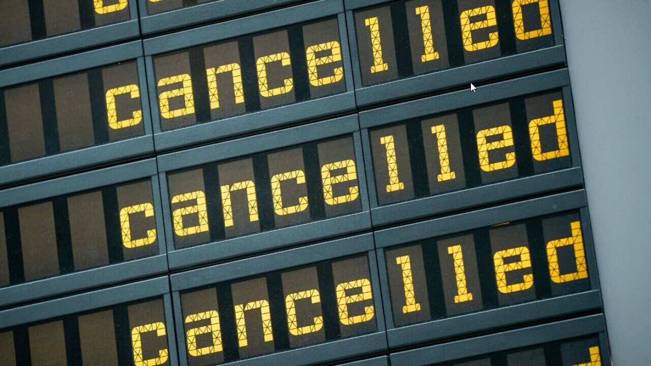 File image of cancellaton messages on airport flight board.