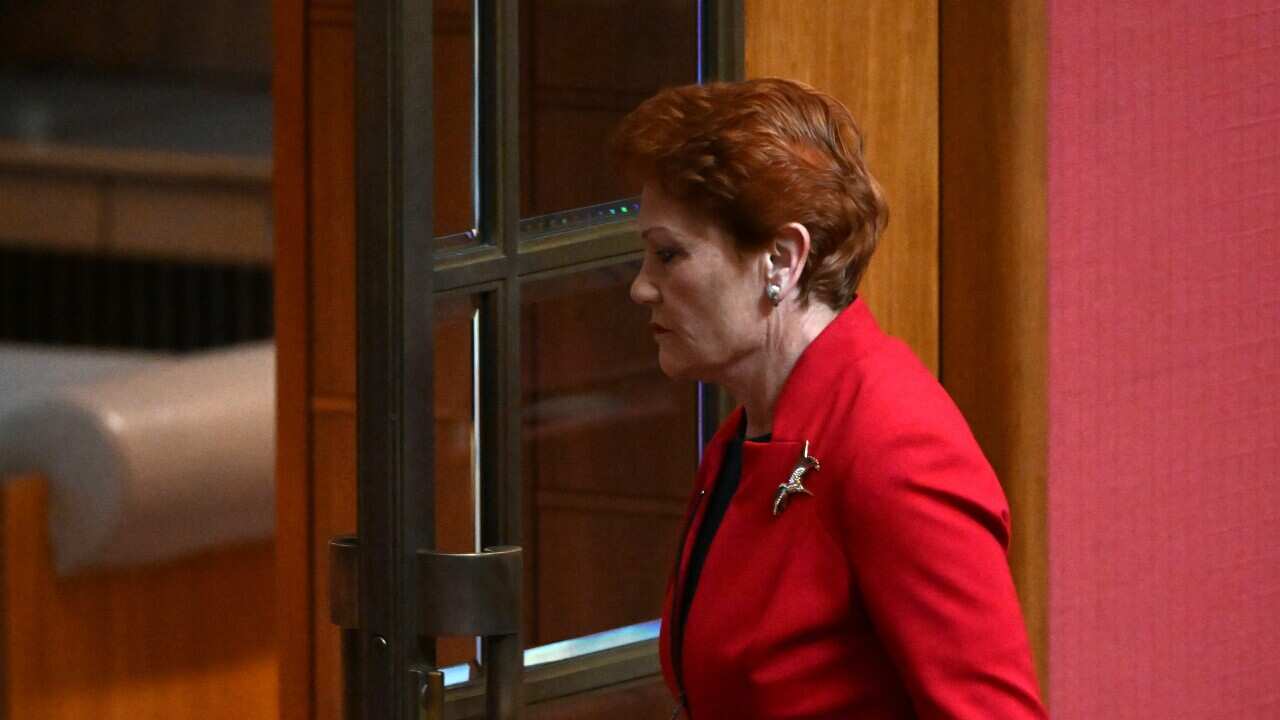 One Nation leader Pauline Hanson walks out after reacting to President Sue Lines acknowledgement of country in the Senate chamber in Canberra, Wednesday, July 27, 2022. (AAP Image/Mick Tsikas) NO ARCHIVING