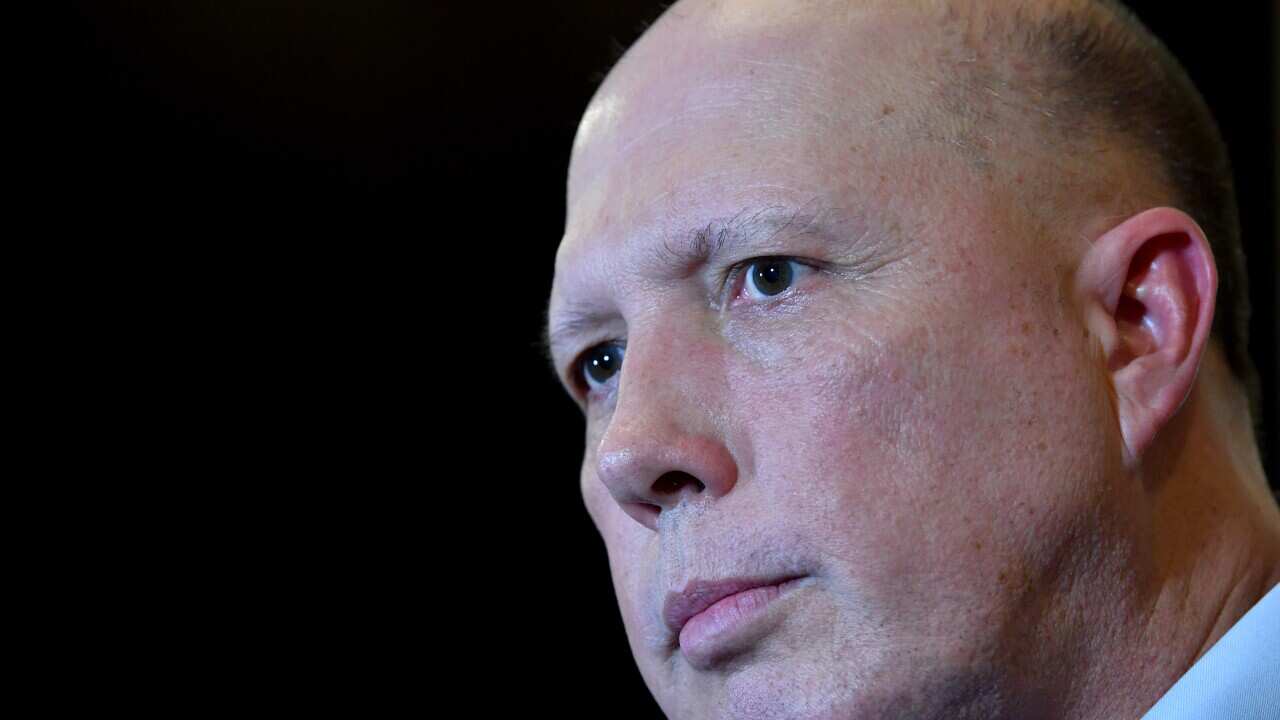 Peter Dutton is seen during a press conference at the Golden Lane Chinese Restaurant in Brisbane, Friday, February 28, 2020