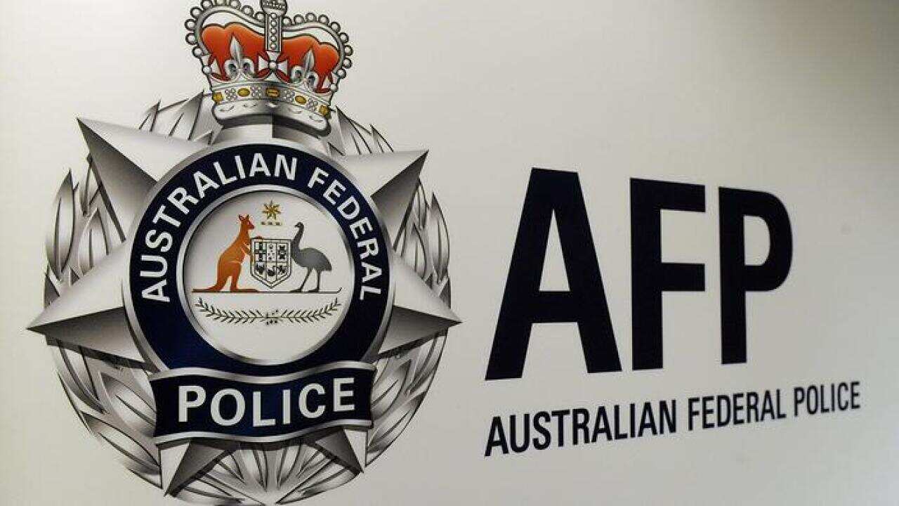 An Australian Federal Police logo is seen in Geelong, Friday, Oct 3, 2014. (AAP Image/Julian Smith) NO ARCHIVING