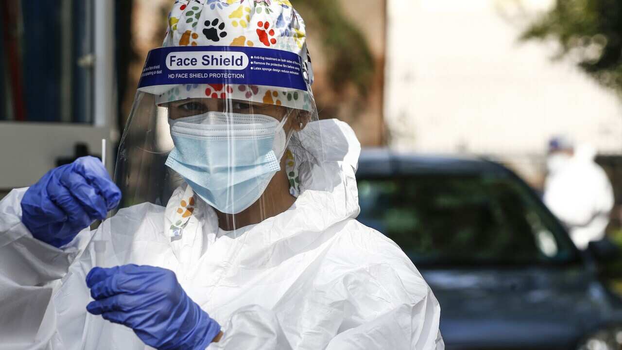 A health worker at a COVID-19 testing clinic in Rome, 14 October, 2020.