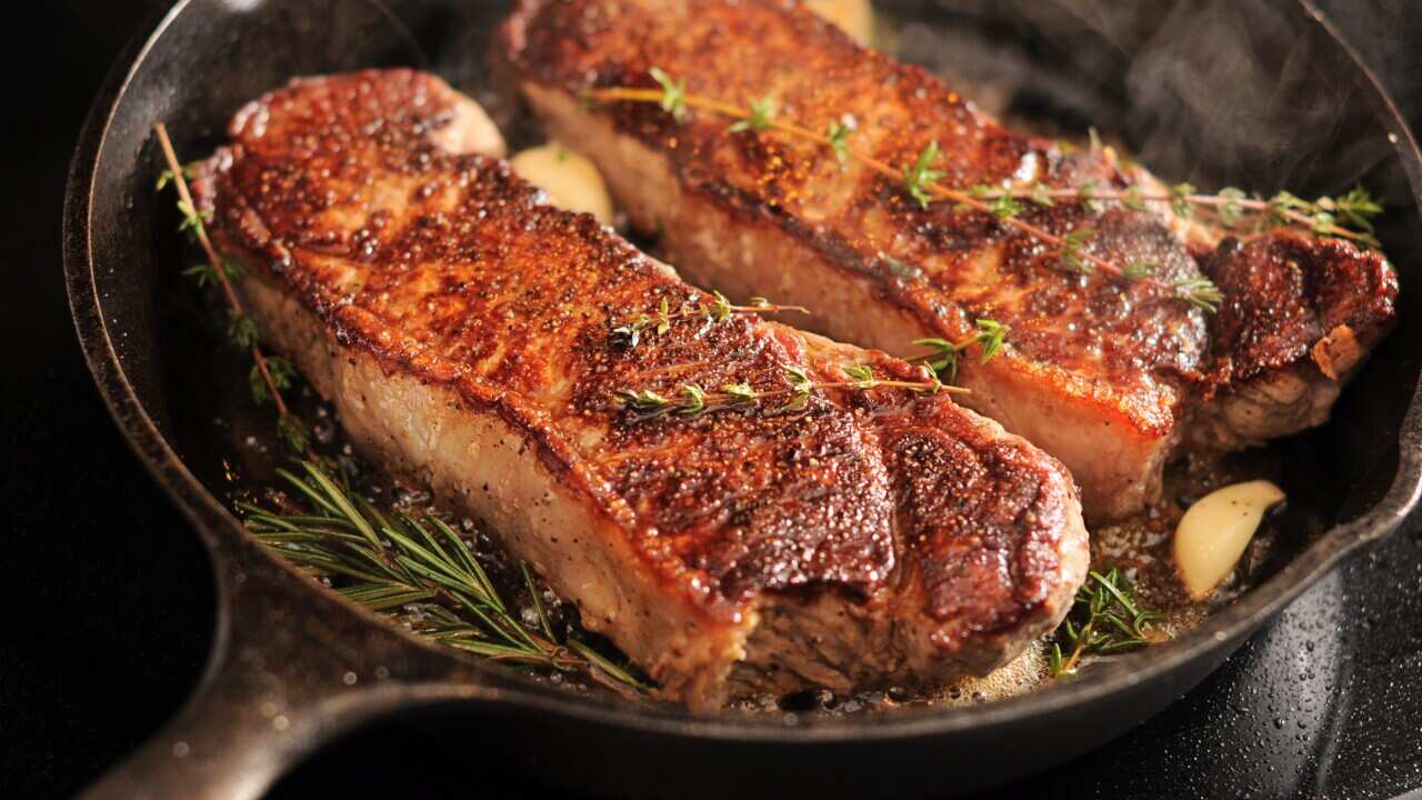 Strip Loin (New York) Steaks in a cast iron pan