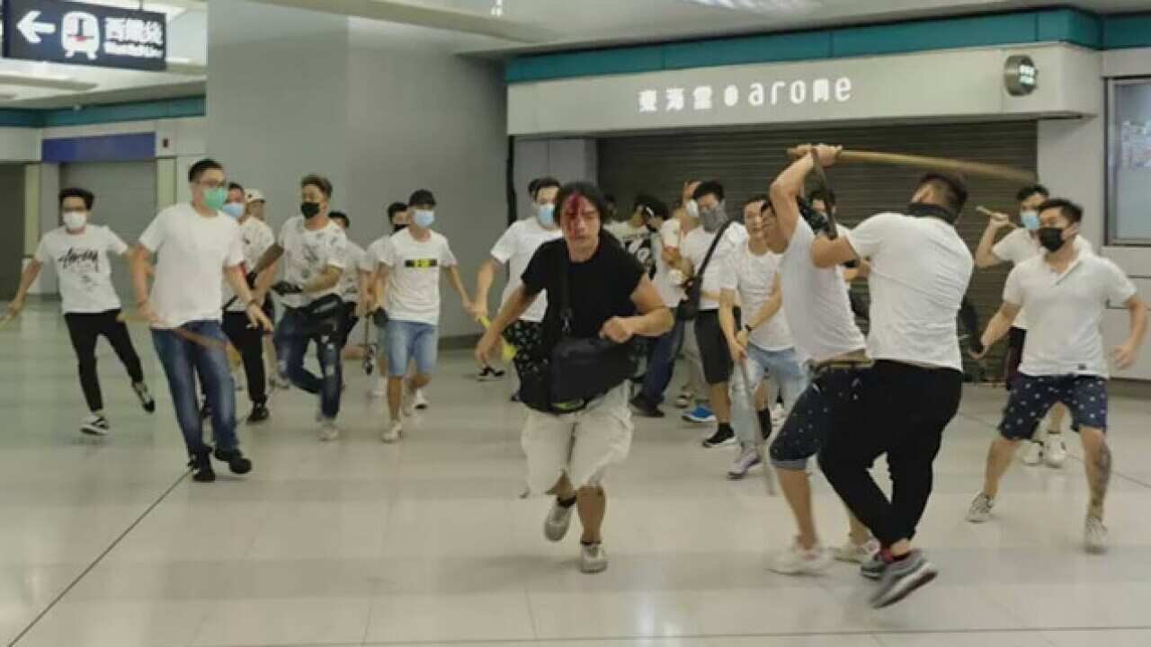 Men dress in white shirts have been filmed attacking protesters in Hong Kong. Vision on social media shows men wielding rods and beating demonstrators at Yuen Long MTR station. 