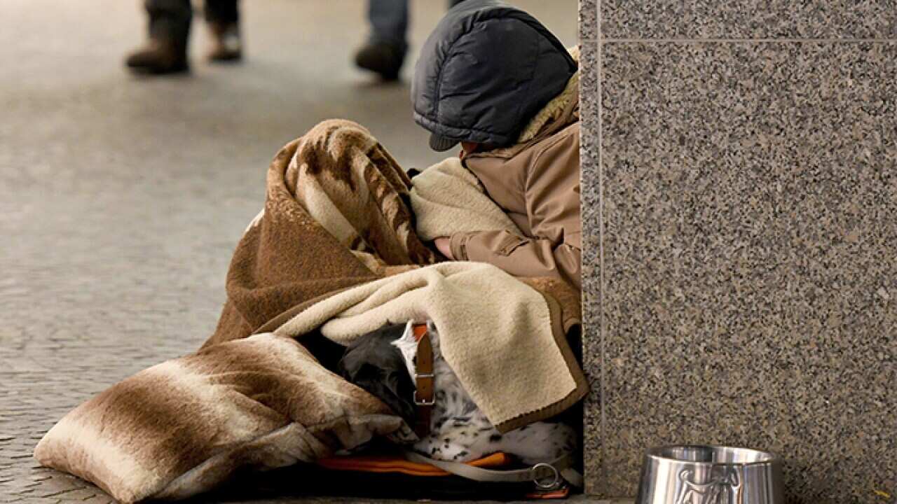 Homeless man sleeping in the street