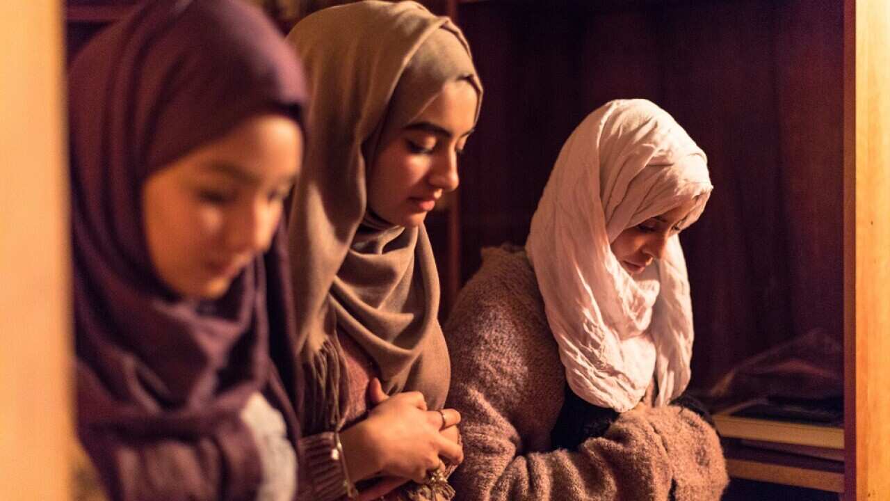 Young Muslim Women praying