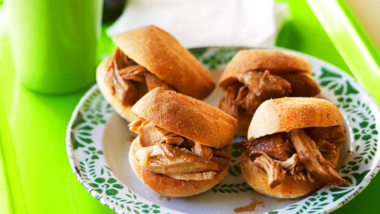 Filipino rolls filled with adobo (adobo pandesal)