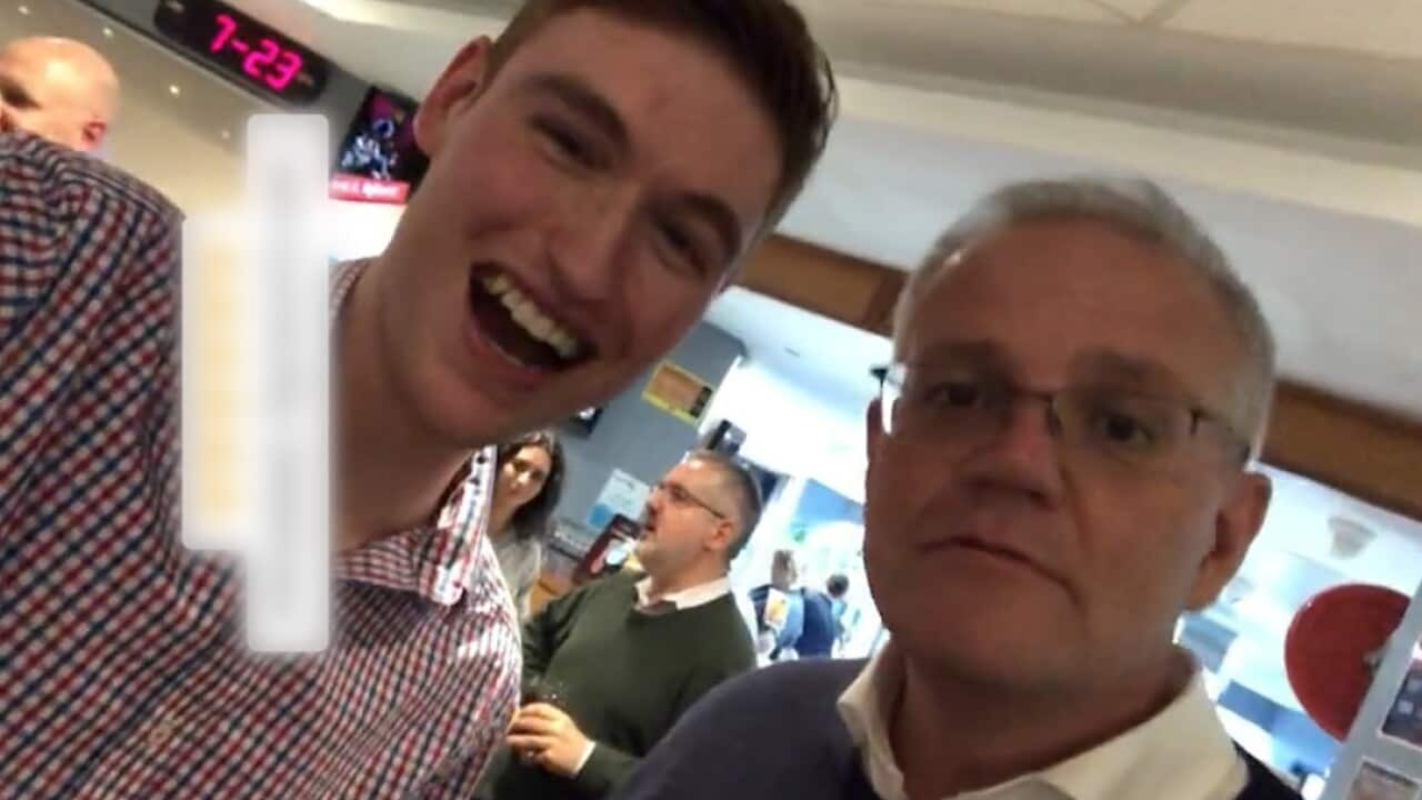 A man posing for a photo with Prime Minister Scott Morrison.