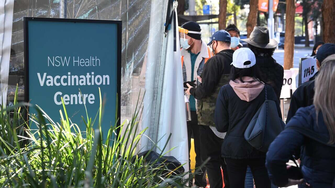 People queuing for the COVID-19 vaccine at a vaccine centre. 