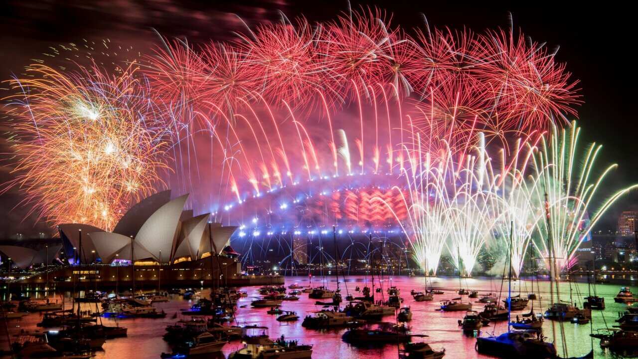 Fireworks explode over the Sydney Harbour during New Year's Eve celebrations in Sydney, Tuesday, January 1, 2019. (AAP Image/Brendan Esposito) NO ARCHIVING