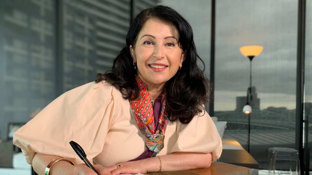 Counsellor Safaa Hakim sitting at her desk.