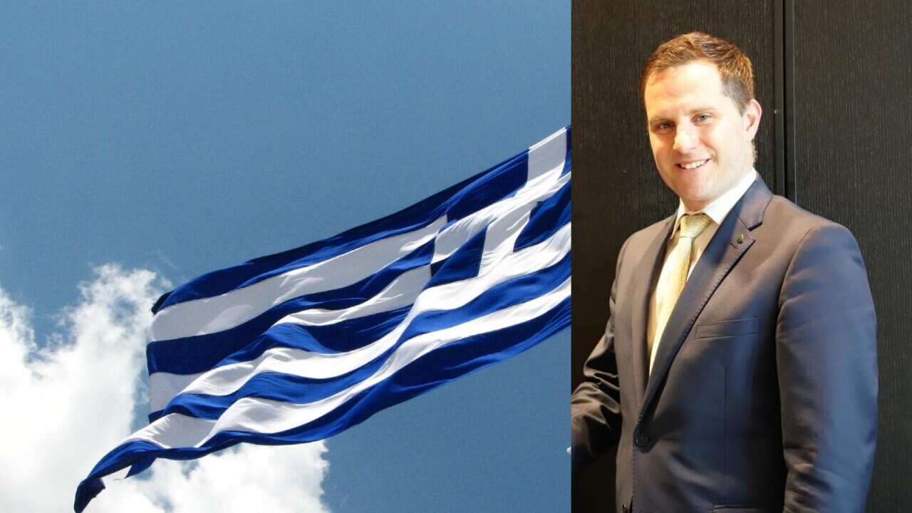 Alex Hawke with Greek flag