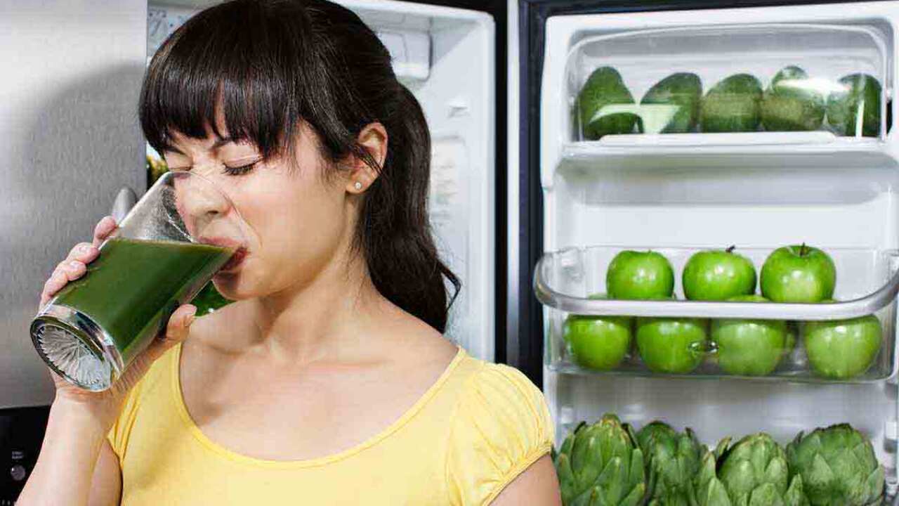 Woman not enjoying her green juice