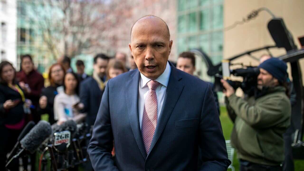 Peter Dutton answers question during a press conference