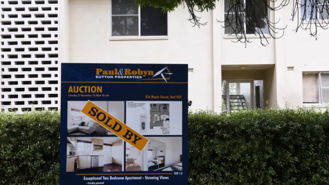 A ’SOLD’ sign is seen outside an apartment block in Canberra. 