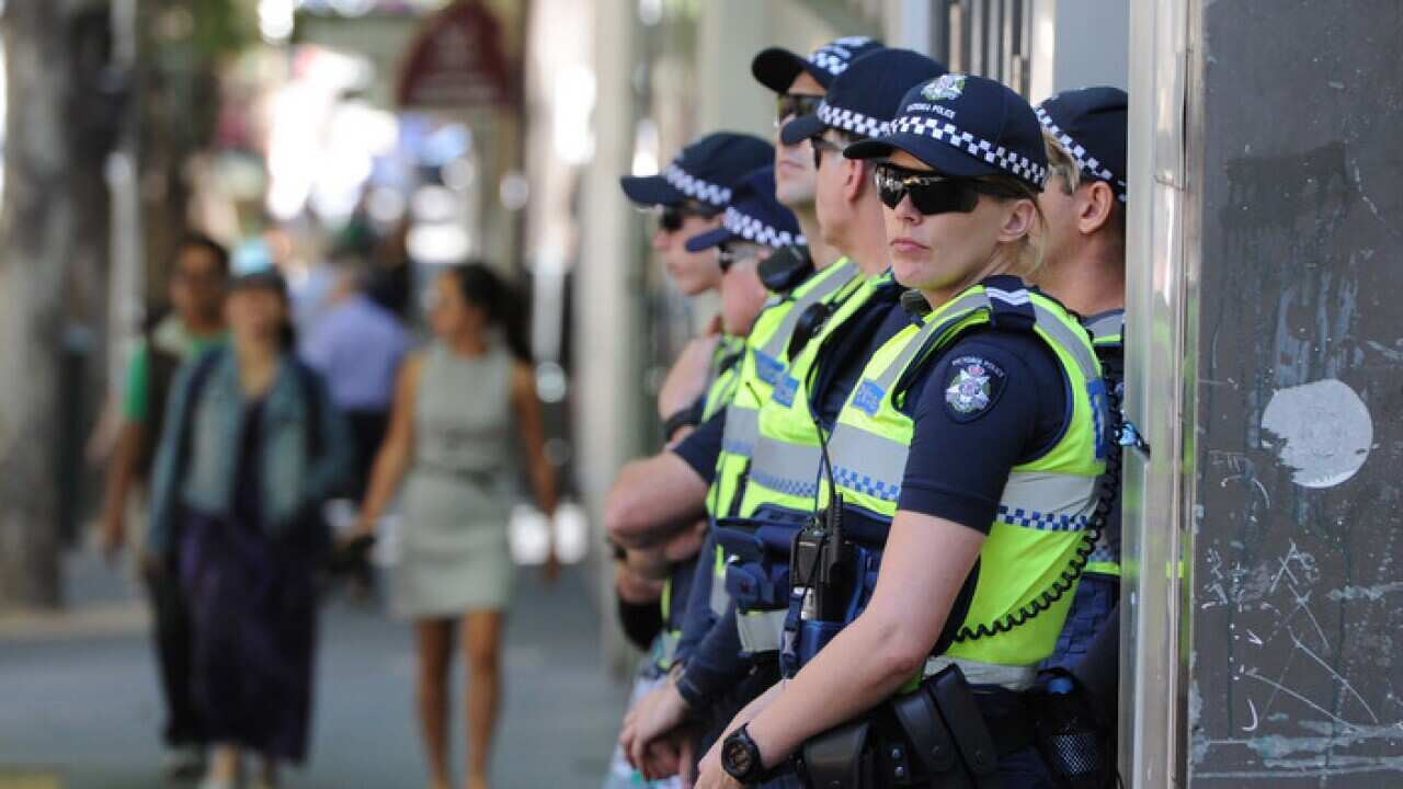 Police officers outside Magistrates Court in Melbourne.